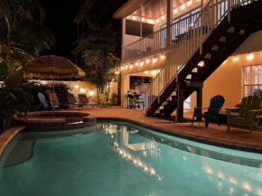 Mango Bay - Gorgeously Renovated Spacious Home wPool Spa Game Room Bikes Walk to Beach